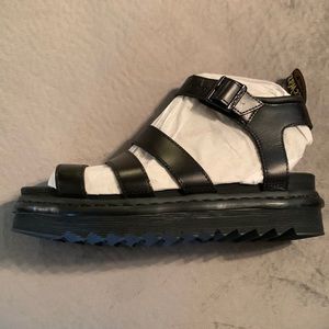 Dr. Martens. Brand new with original box.